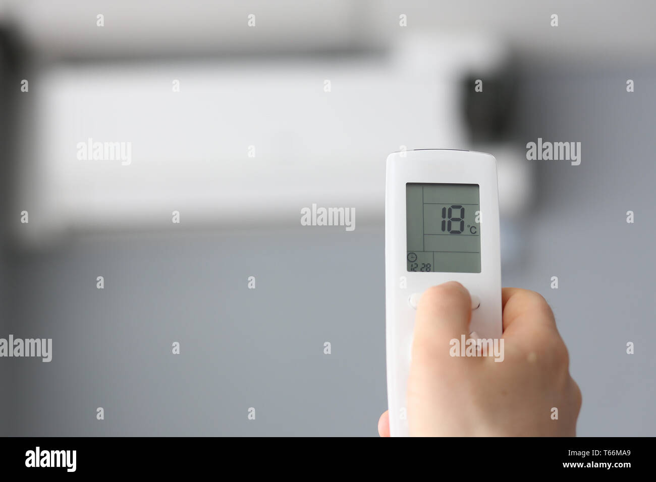 Male hand hold remote air conditioning Stock Photo Alamy