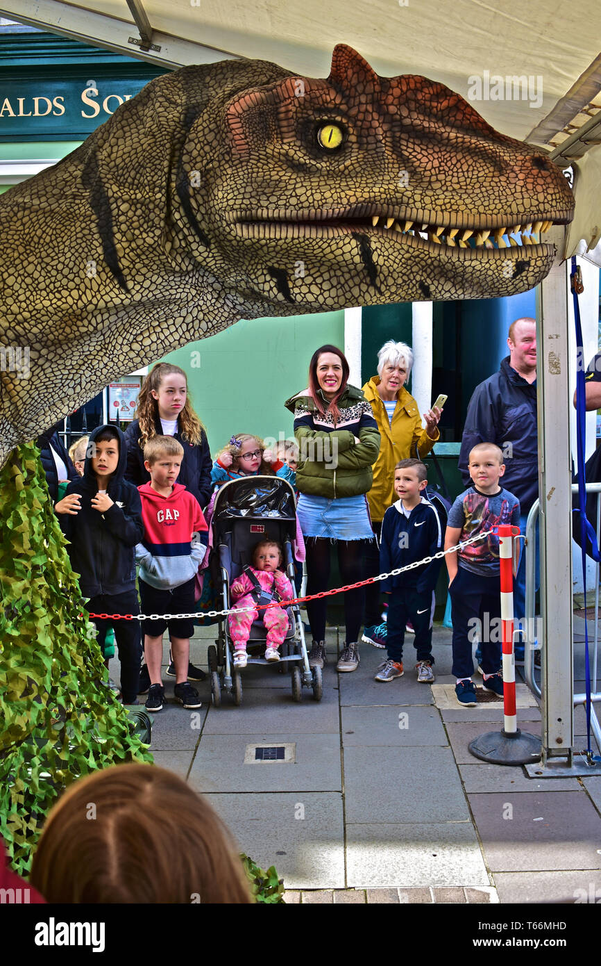 A dinosaur brought to life! 'Little Al' enthralled the crowds of adults and children on Thursday April 25th 2019, in Dunraven Place in Bridgend, Stock Photo