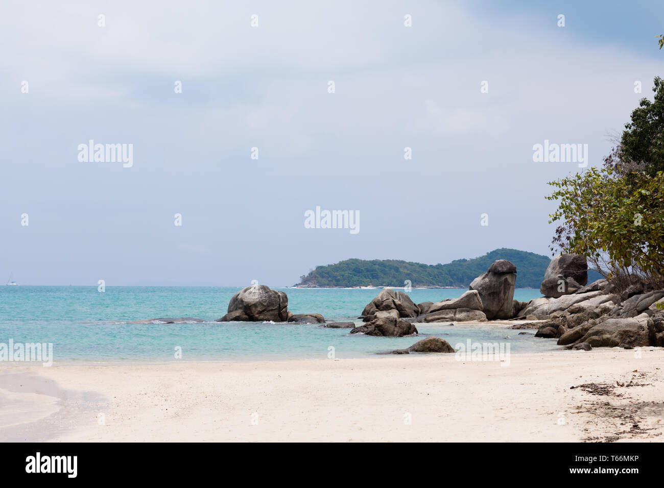 Tropical white sand sea coast beach with blue water Stock Photo