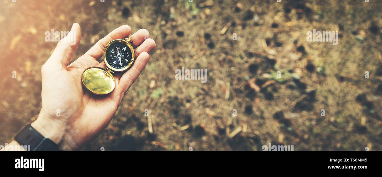 direction search exploration concept - compass in hand Stock Photo