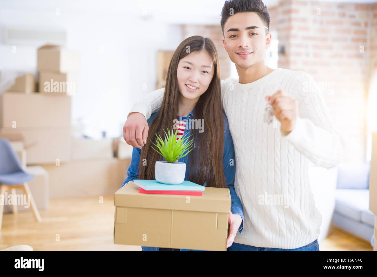 Young Asian Couple Holding Keys Of New House, Smiling Happy And Excited ...