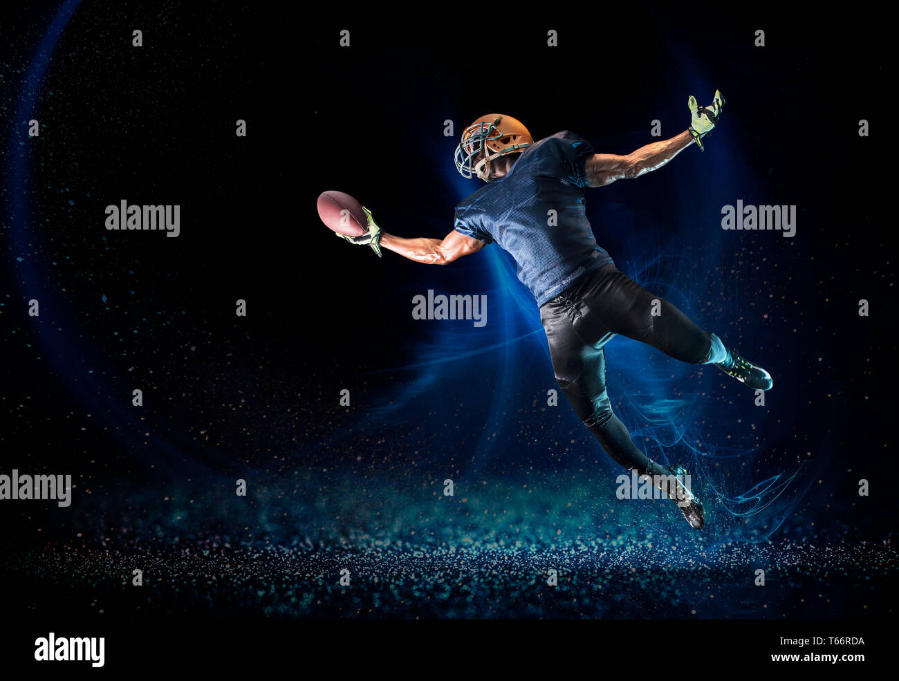 Football player reaching to catch football Stock Photo Alamy