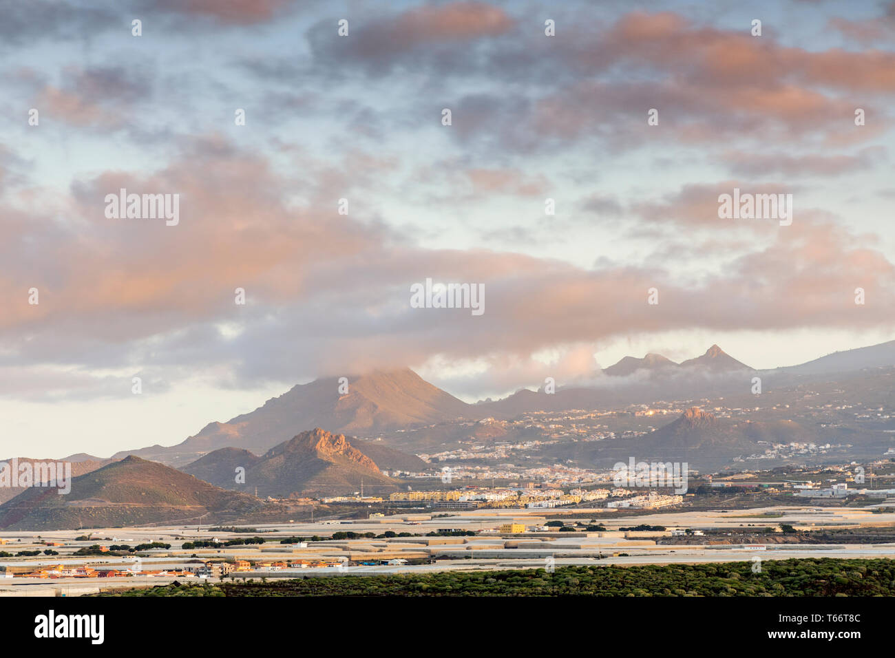 Dawn view towards Roque del Conde and Roque Imoque from Montana amarilla, yellow mountain, Tenerife, Canary Islands, Spain Stock Photo