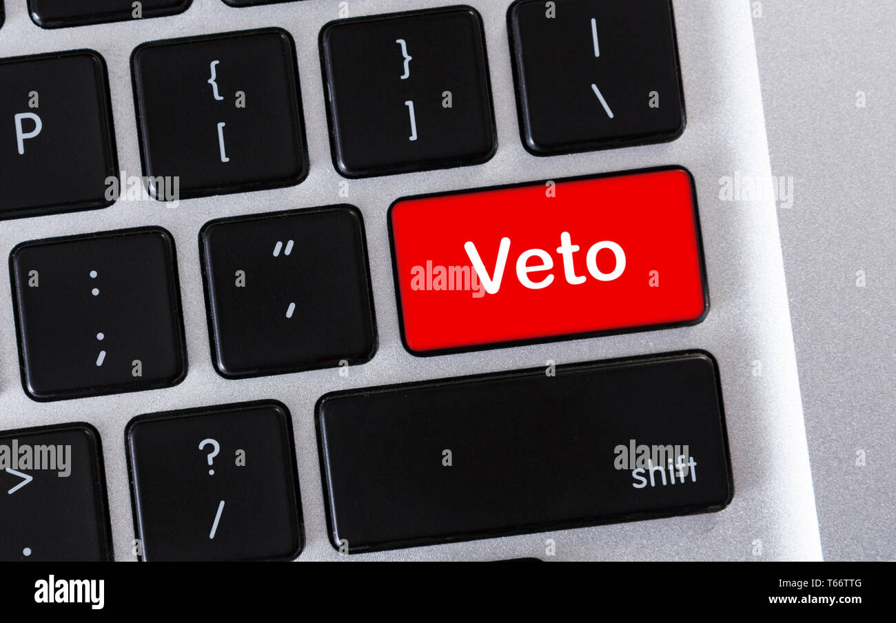 Prohibition concept. Word Veto written on red button of computer keyboard. Stock Photo