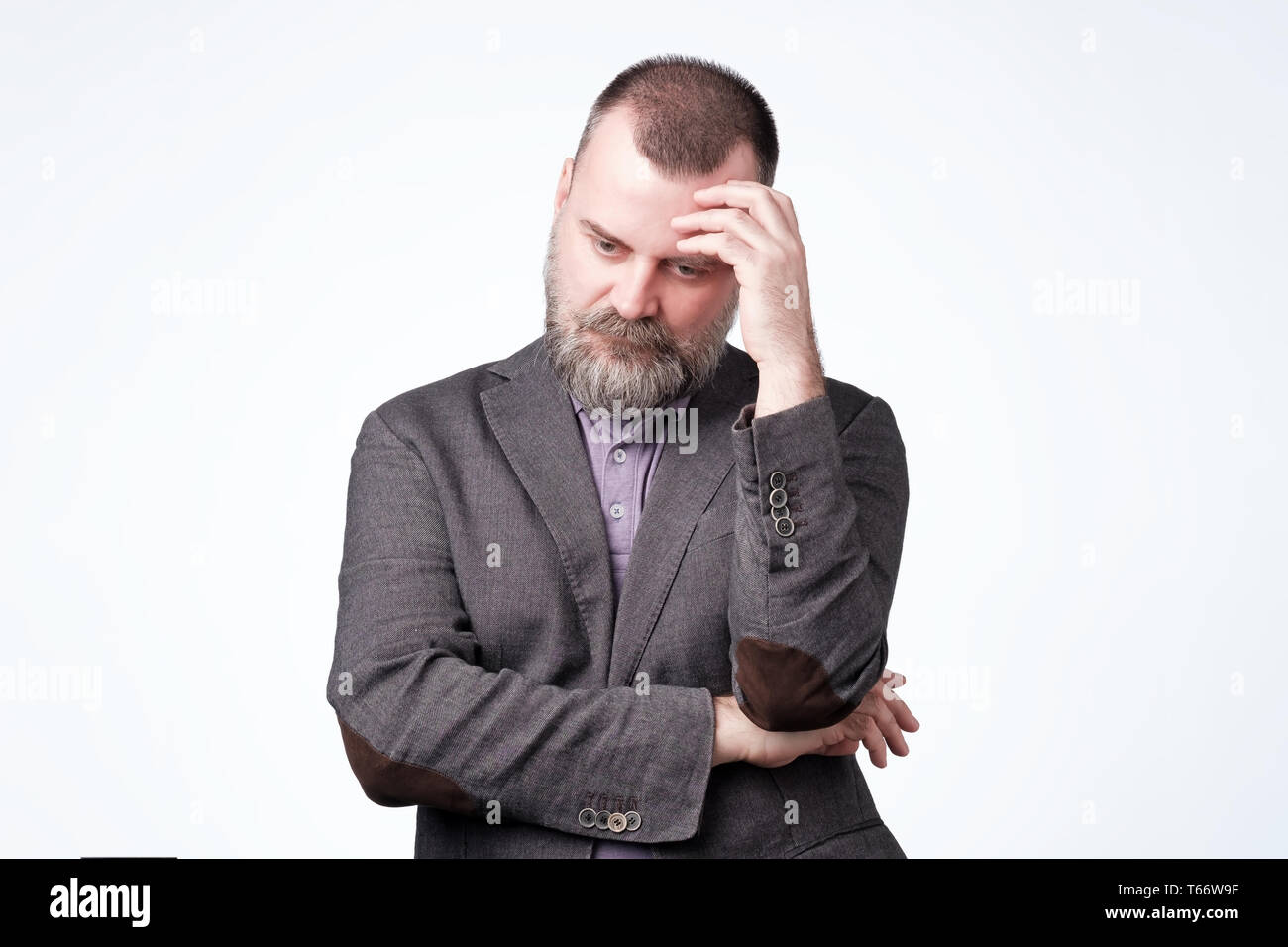 Mature caucasian man thinking about his life problem. Stock Photo