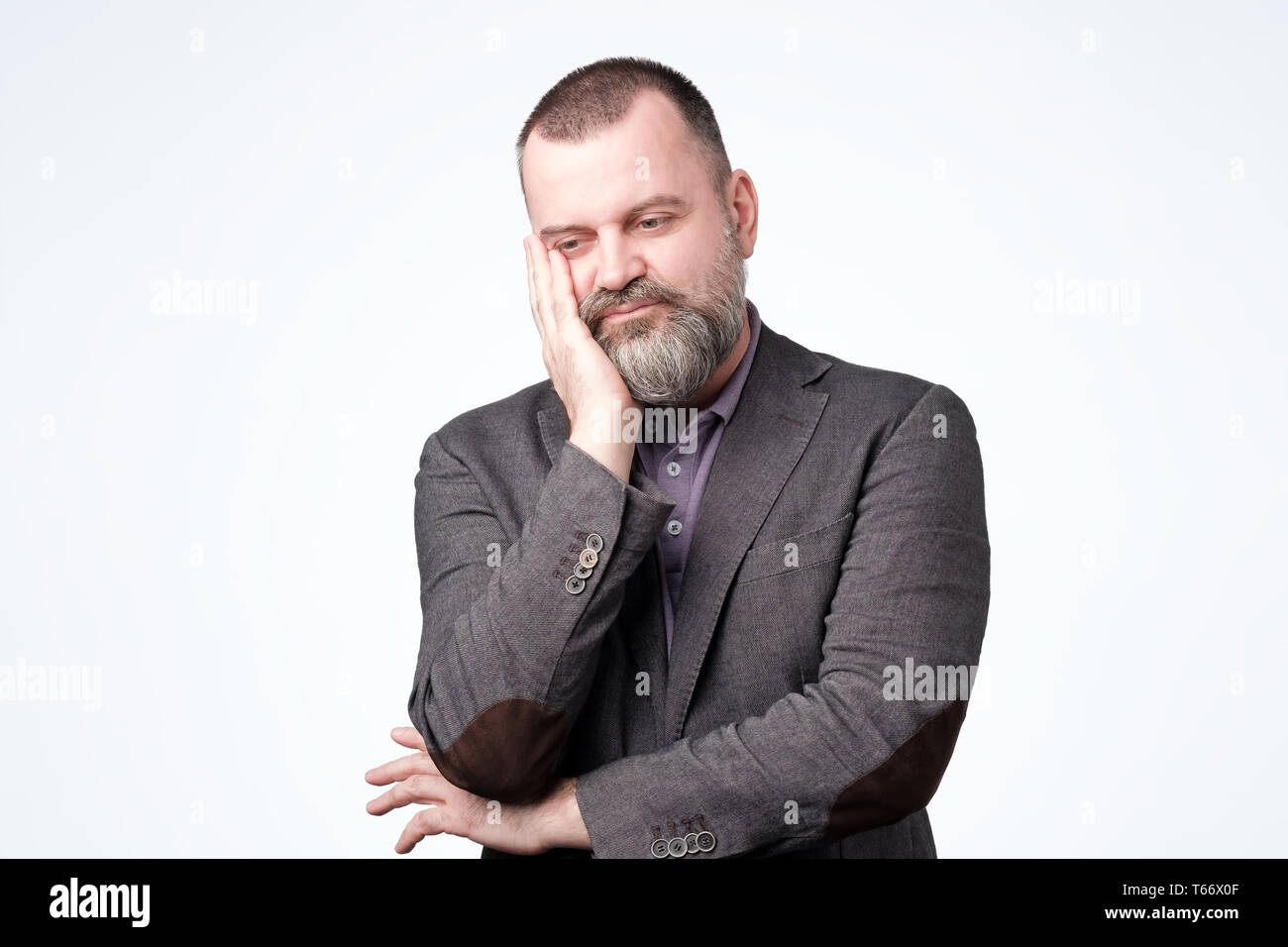 Mature caucasian man thinking about his life problem. Stock Photo
