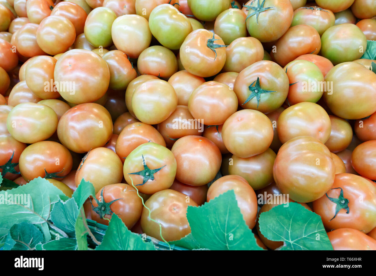 A stack of tomatoes on display for sale Stock Photo - Alamy