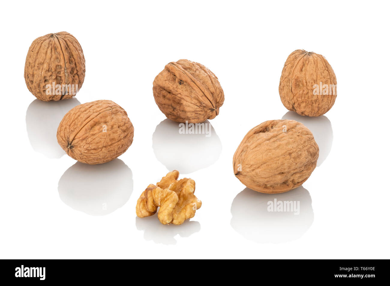 Walnuts with and without nutshell white isolated Stock Photo