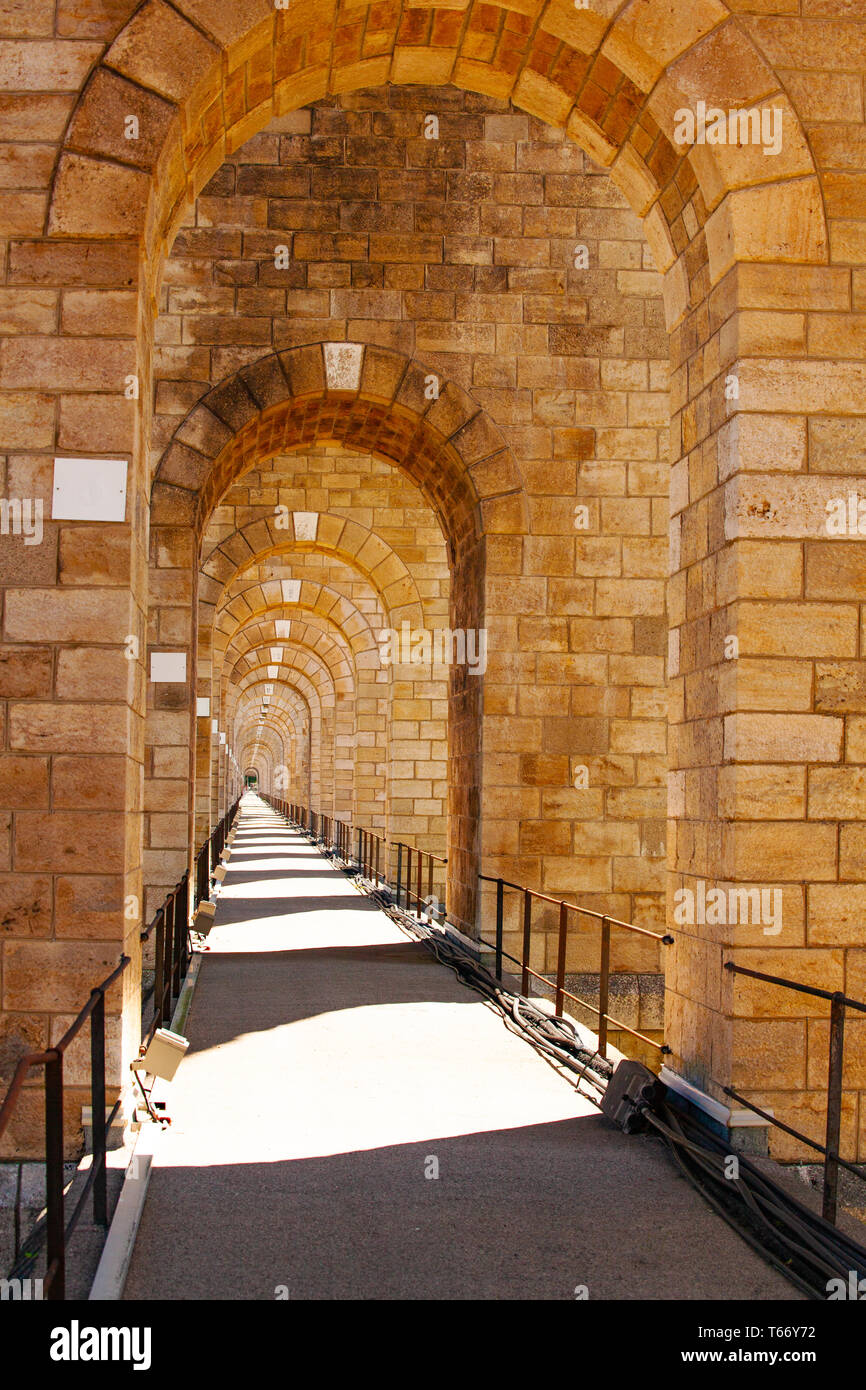 Perspective of stone arched abutments and sidewalk of Chaumont viaduct first level, France, Europe Stock Photo