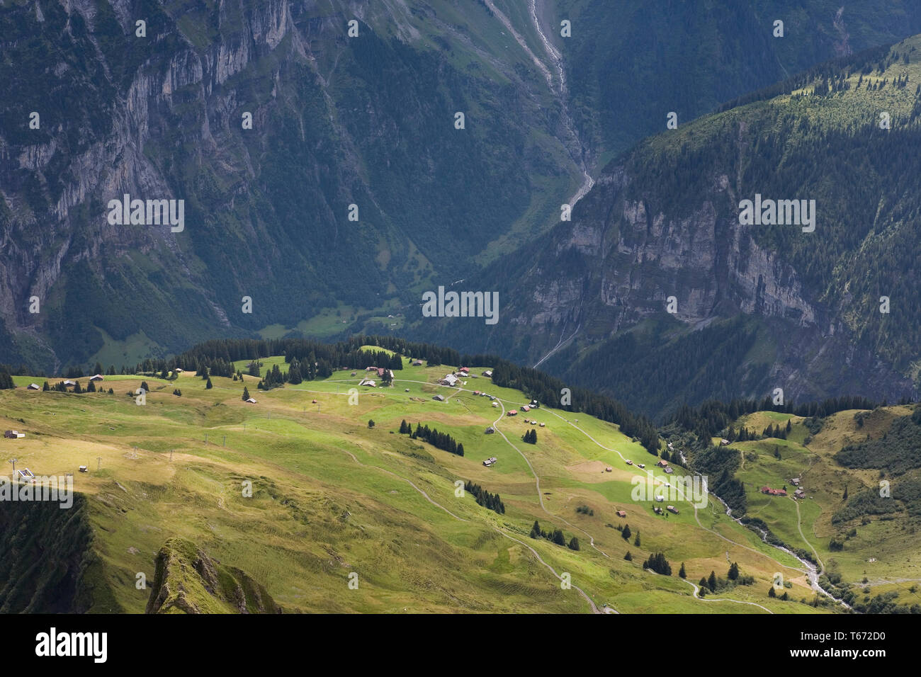 3 valleys: the Lauterbrunnental in the distance, the Sefinental below the cliff, and the Schilttal in the foreground, Bernese Oberland, Switzerland Stock Photo