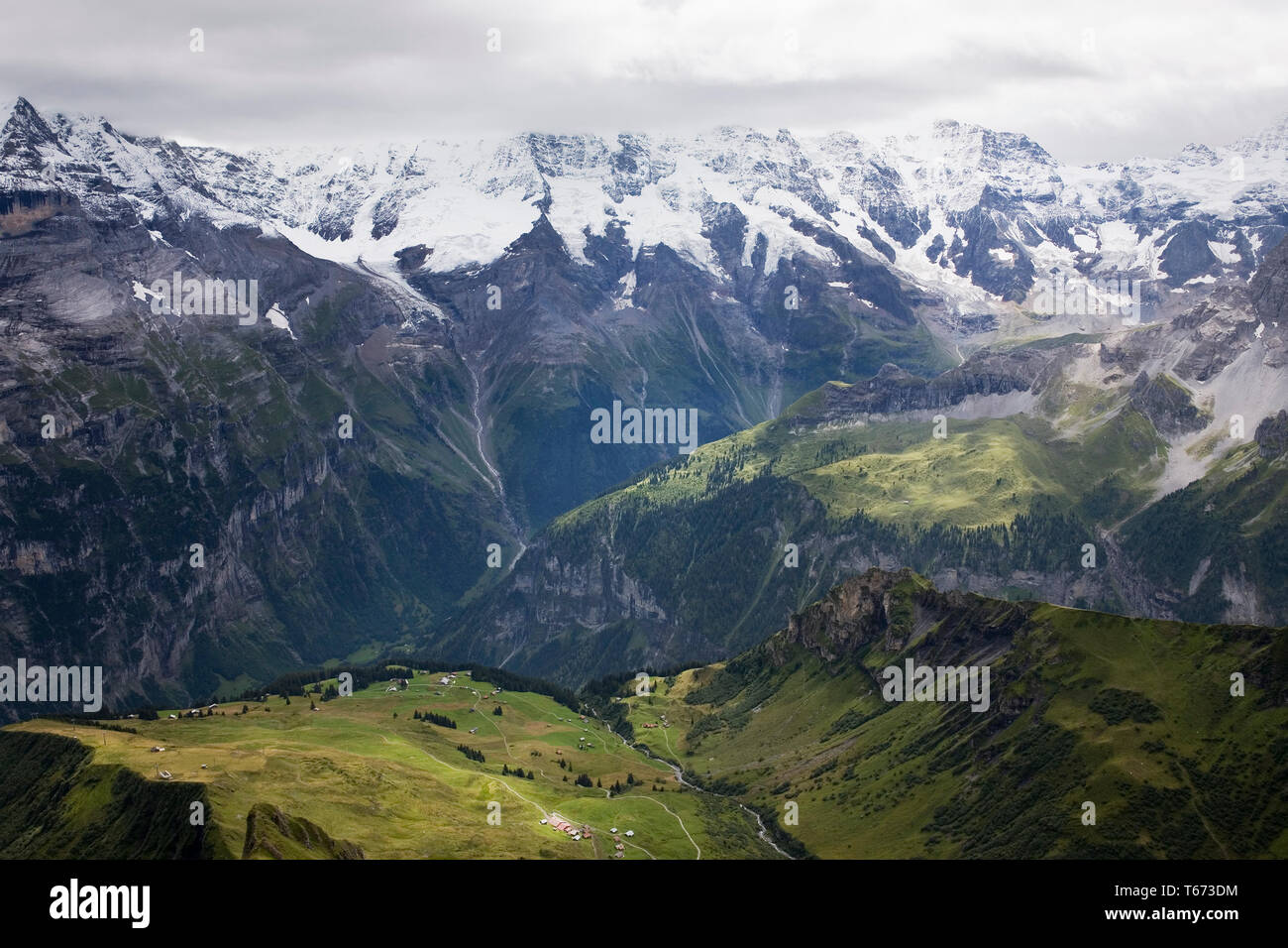 View down the Schiltal from the Birg cablecar station, with the Jungfrau Massif and the Lauterbrunnen valley beyond, Bernese Oberland, Switzerland Stock Photo
