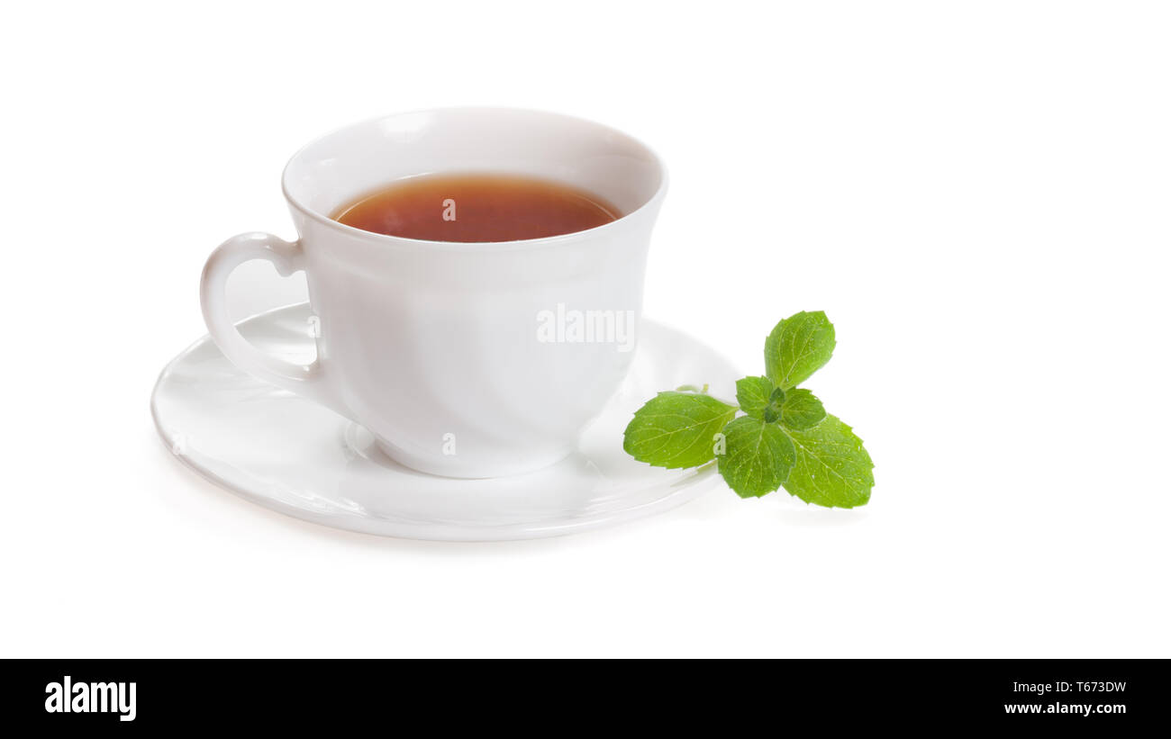 White Cup of tea with mint melissa herb isolated with clipping path Stock Photo