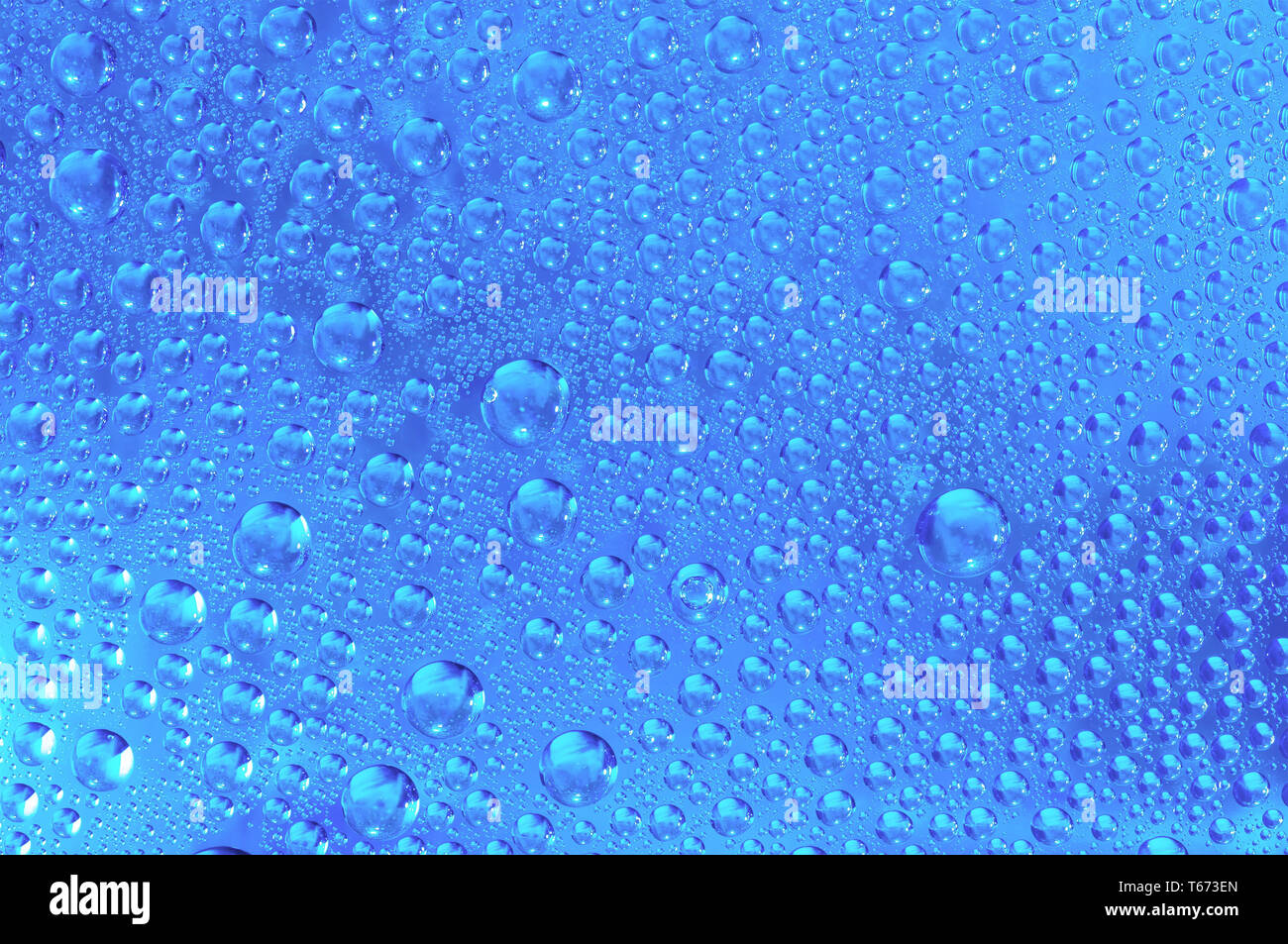 blue wet rainy background, water drops on transparent glass Stock Photo