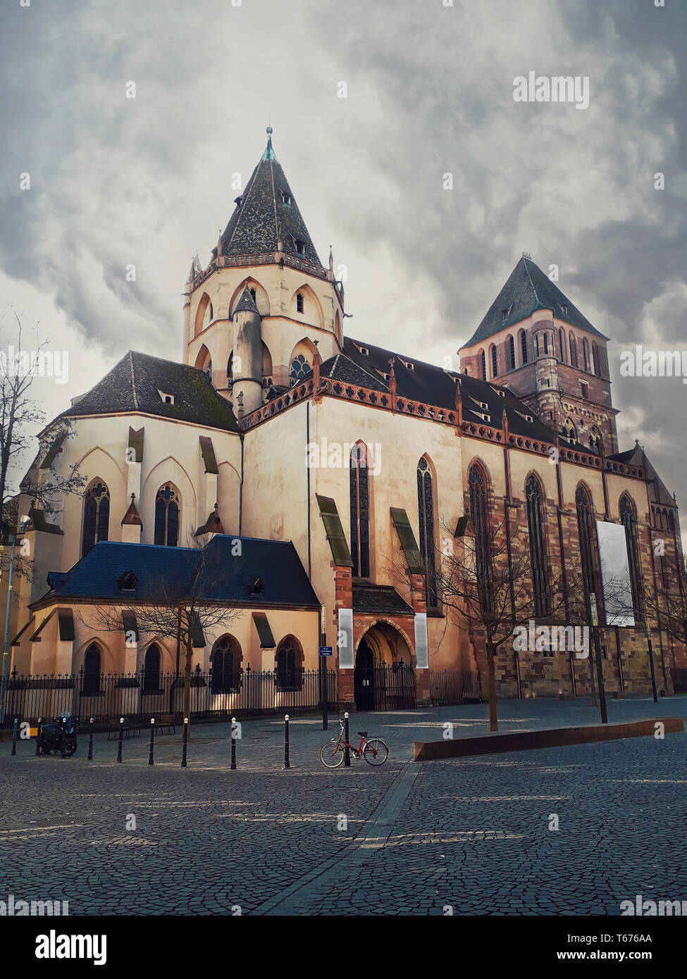 Saint Thomas church in Strasbourg, gloomy cloudy morning. Protestant cathedral, gothic architecture style. Strasbourg, Alsace, France Stock Photo