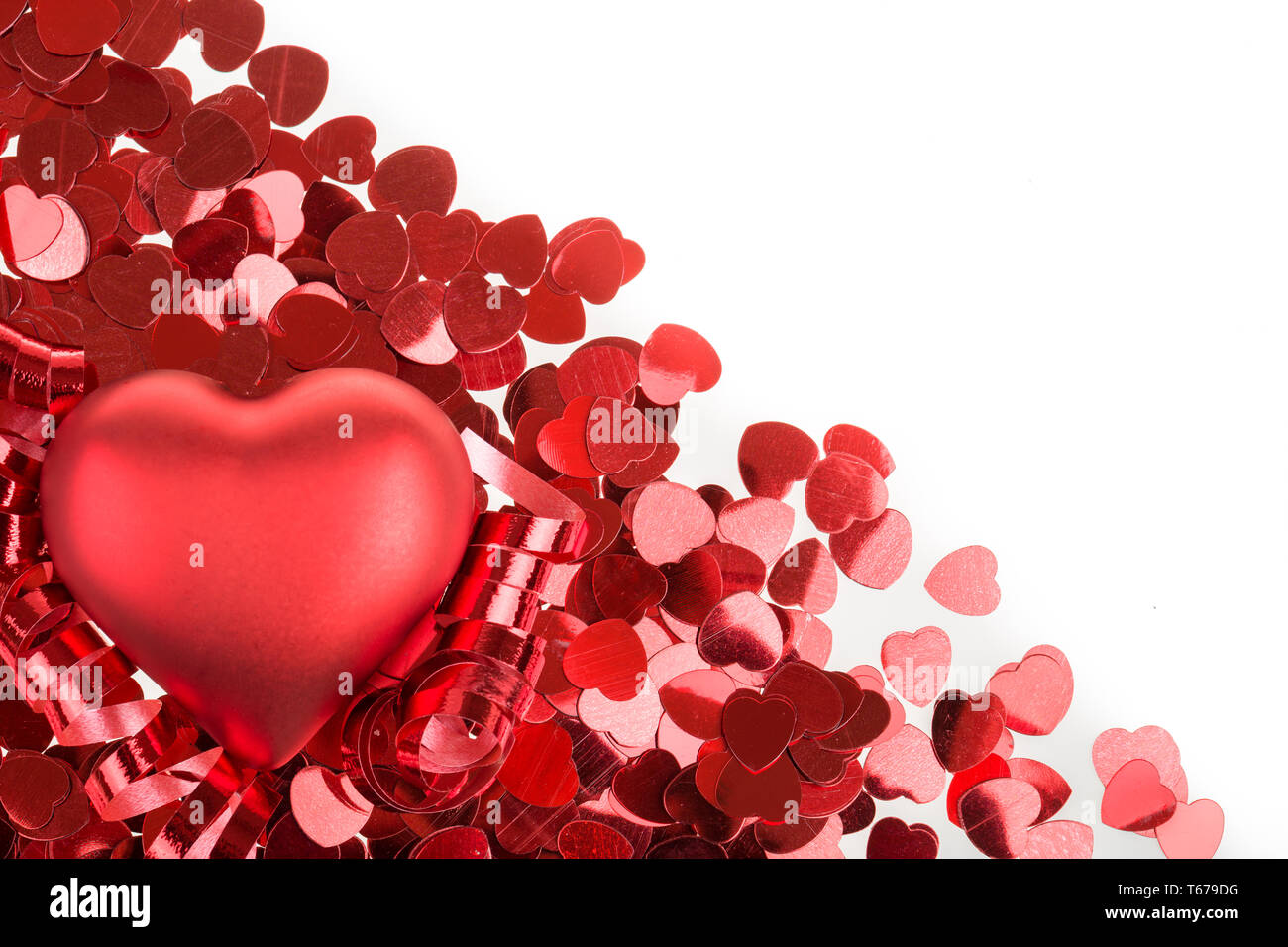 Red hearts confetti on white background Stock Photo - Alamy