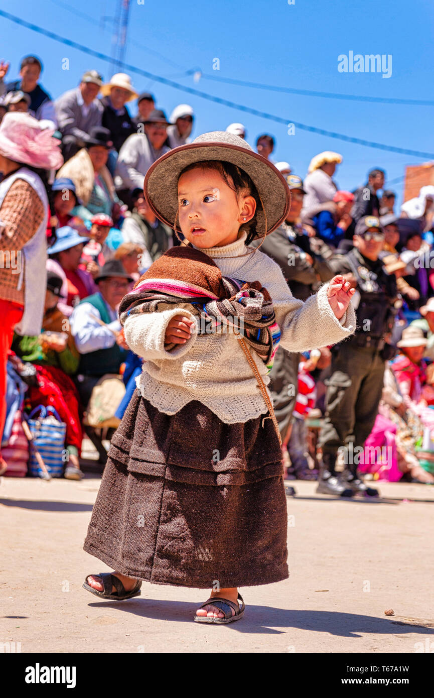 Oruro, Bolivia, March 3, 2011: Little Street Dancer at Anata Andina or Andean Carnival. Pre Hispanic Festival linked to the cycle of agricultural prod Stock Photo