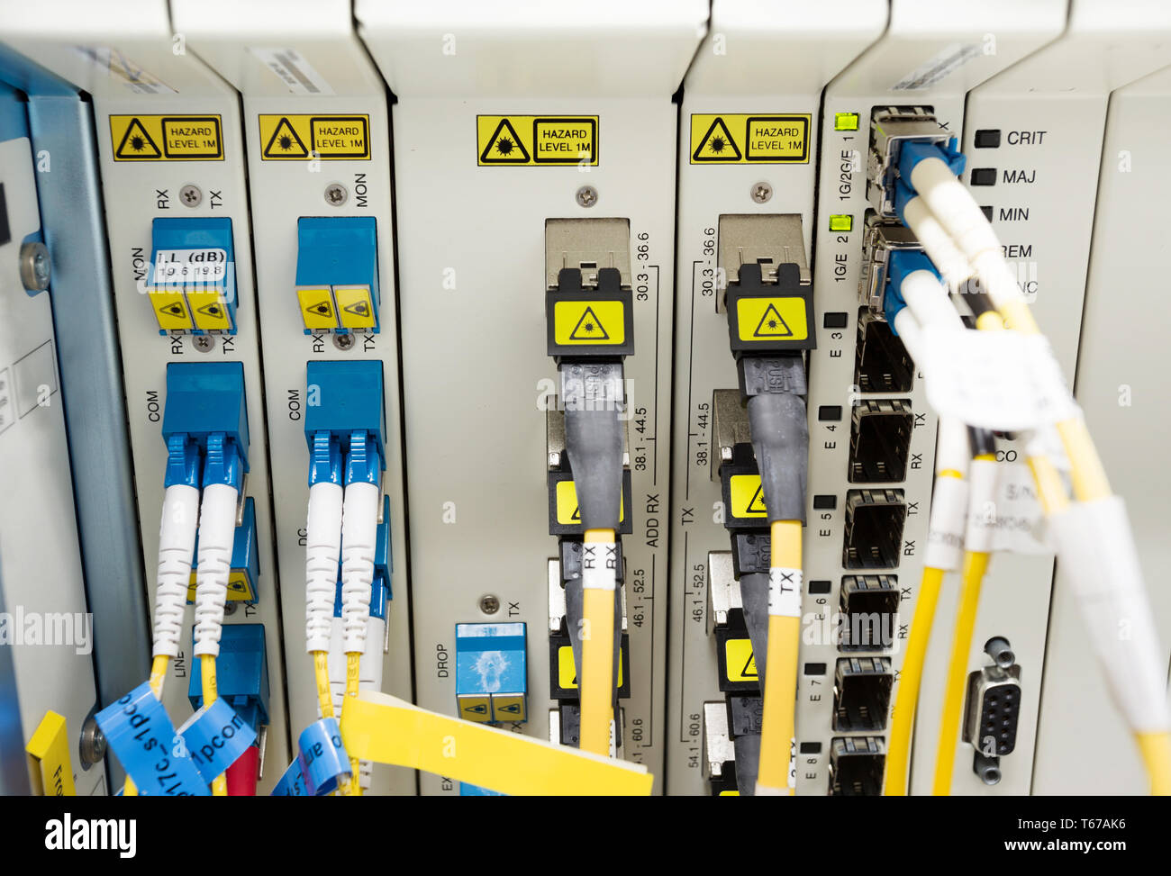 fiber optic datacenter with media converters and optical cables Stock Photo