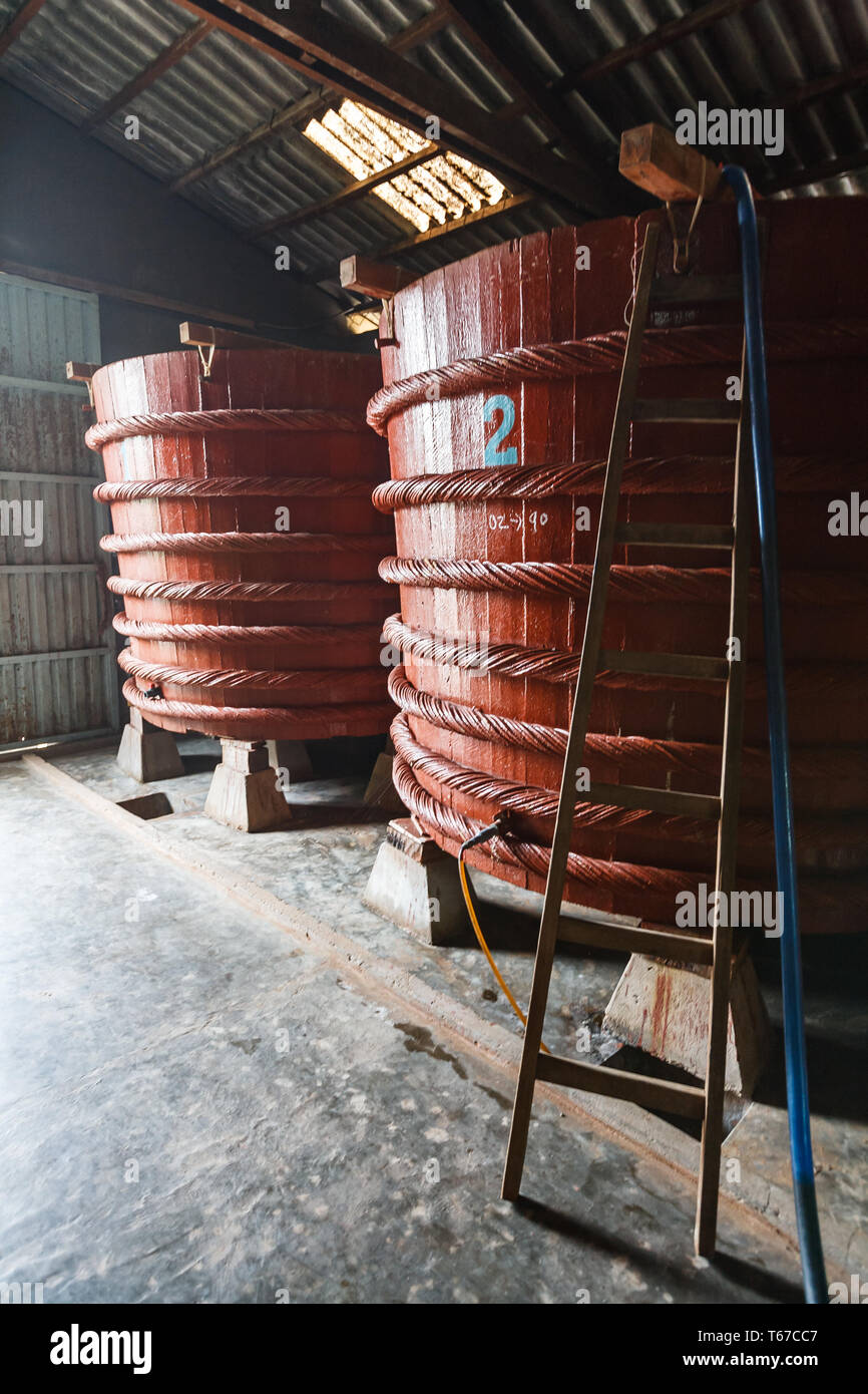 Closeup of two red vats fermenting a fish sauce for 1 year before selling Stock Photo