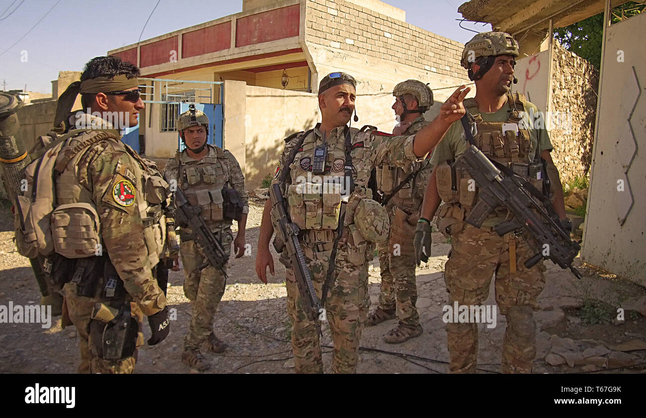 Captain Iraq MOSUL, center, pointing: Captain Alaa, Unit Commander, Iraqi Special ...