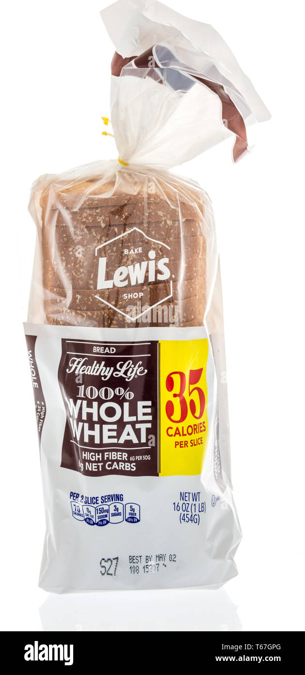 Winneconne, WI -  22 April 2019: A package of Bake Lewis shop whole wheat loaf bread on an isolated background Stock Photo