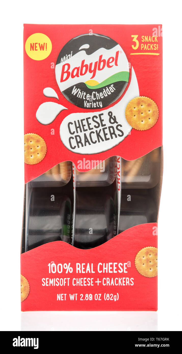 Winneconne, WI -  22 April 2019: A package of Babybel white cheddar cheese and crackers on an isolated background Stock Photo