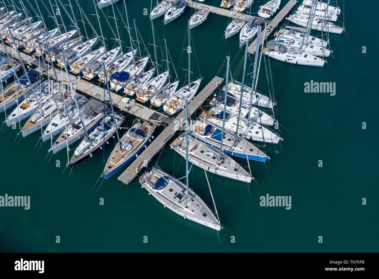 Aerial view of a lot of white boats and yachts moored in marina. Photo ...
