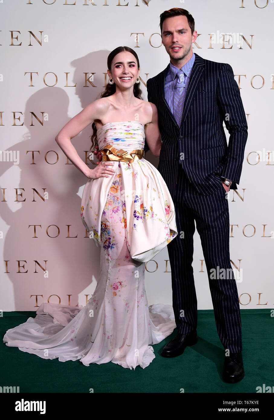 Lily Collins (left) and Nicholas Hoult poses for photos during the UK