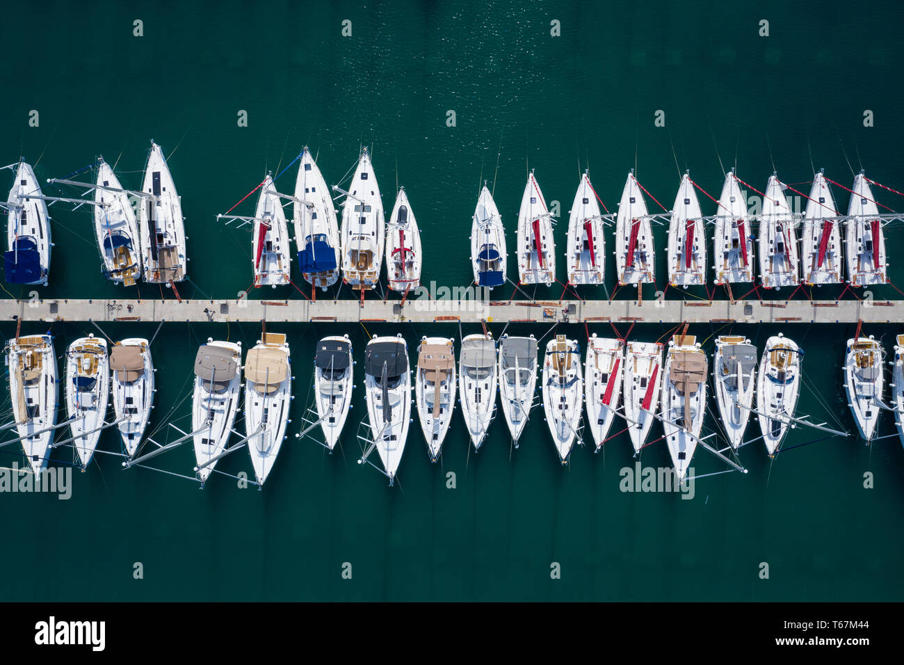Aerial view of a lot of white boats and yachts moored in marina. Photo ...