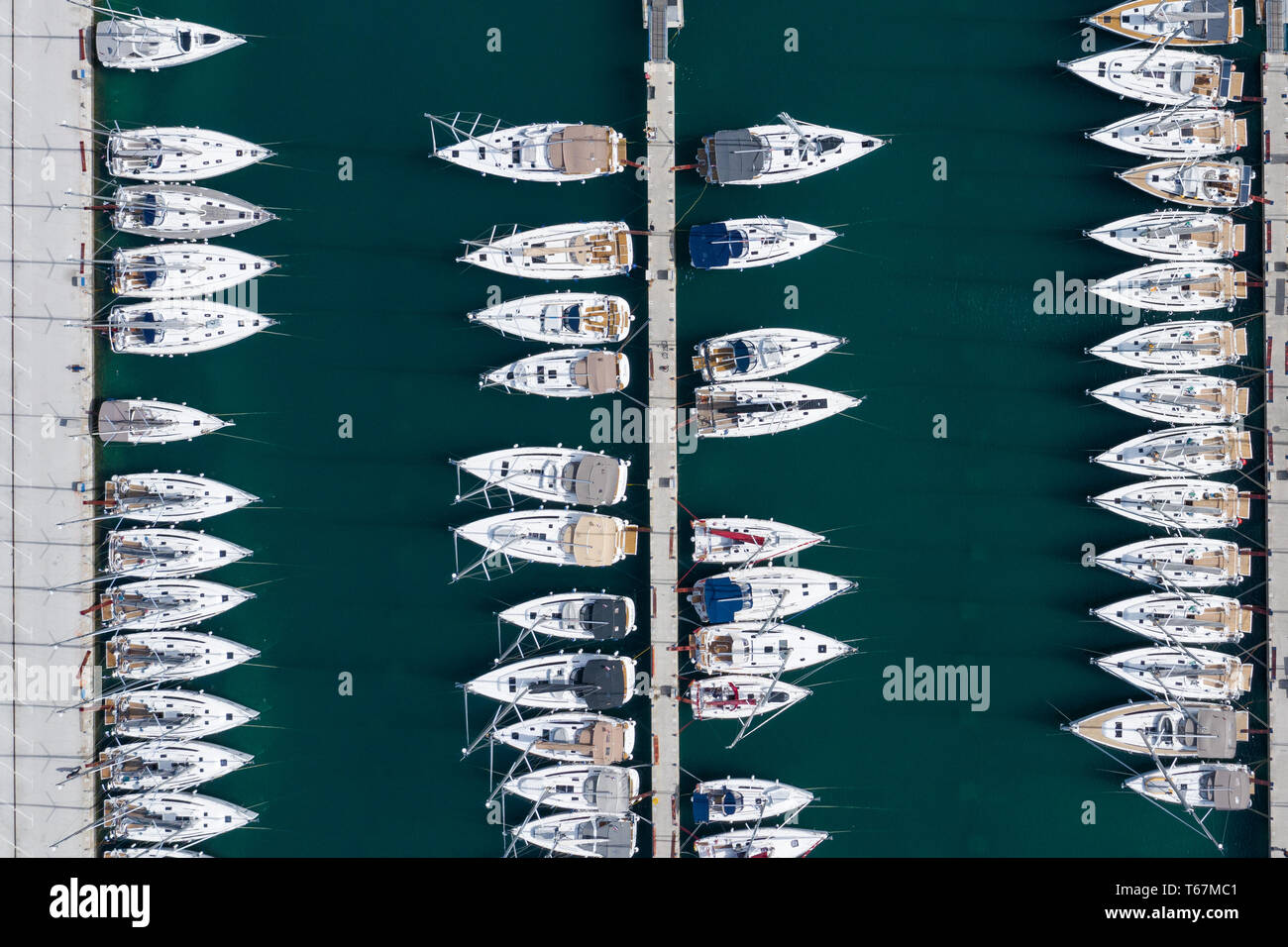 Aerial view of a lot of white boats and yachts moored in marina. Photo ...