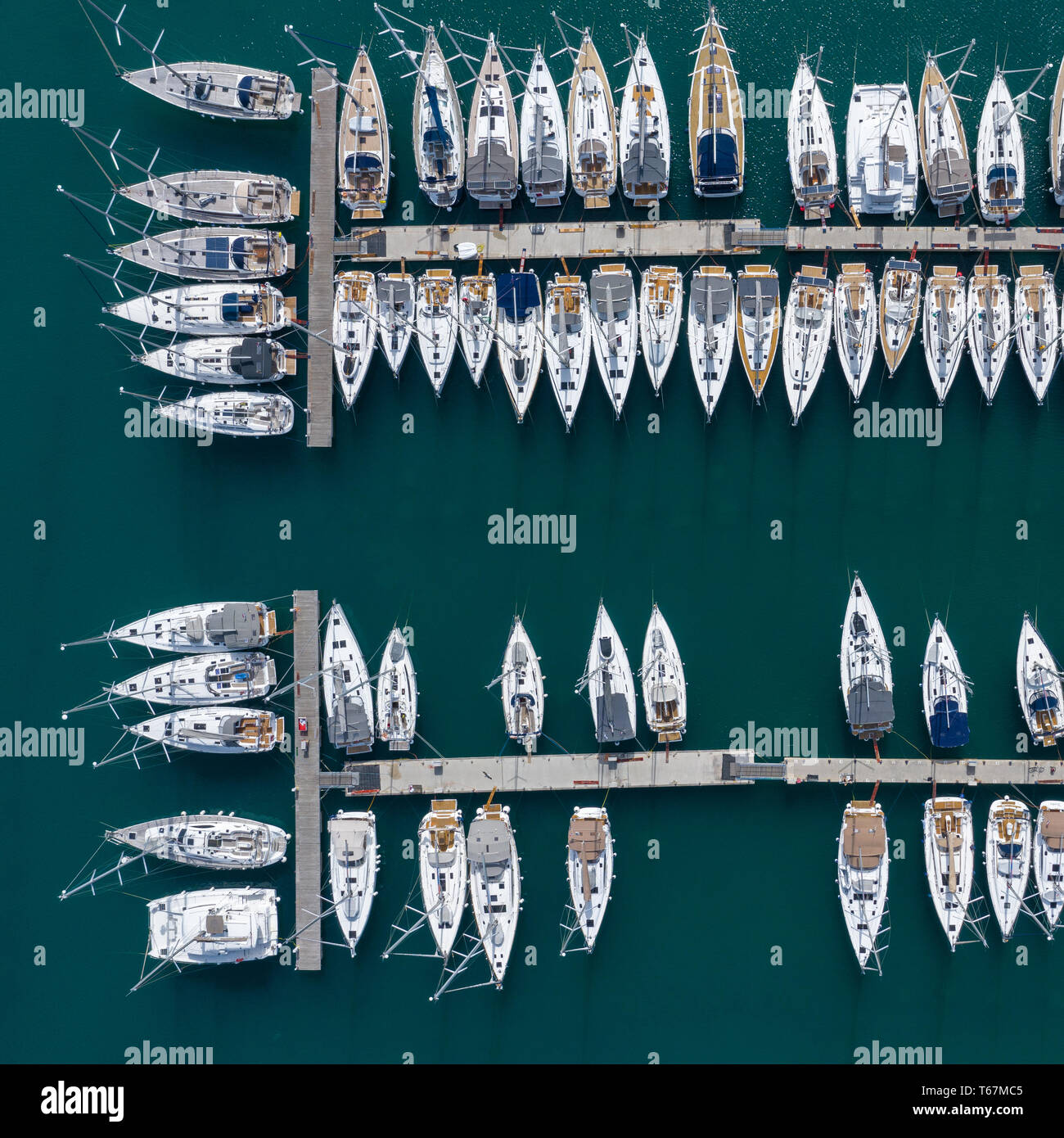 Aerial view of a lot of white boats and yachts moored in marina. Photo ...