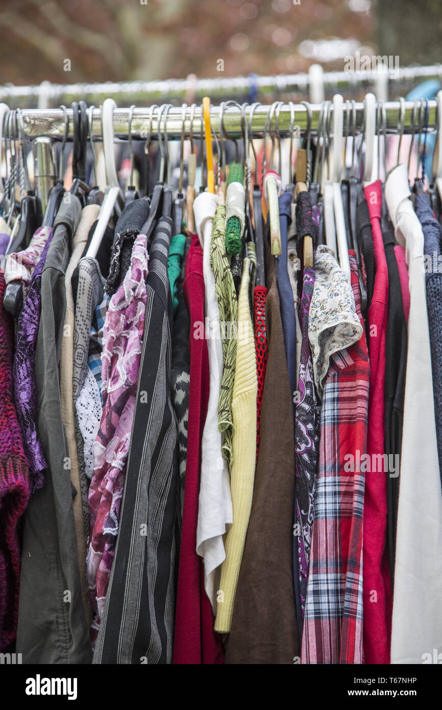 clothes on a rack in a flea market Stock Photo