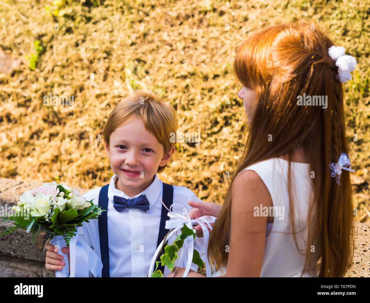 Ring bearer and flower girl at summer garden wedding Stock Photo Alamy