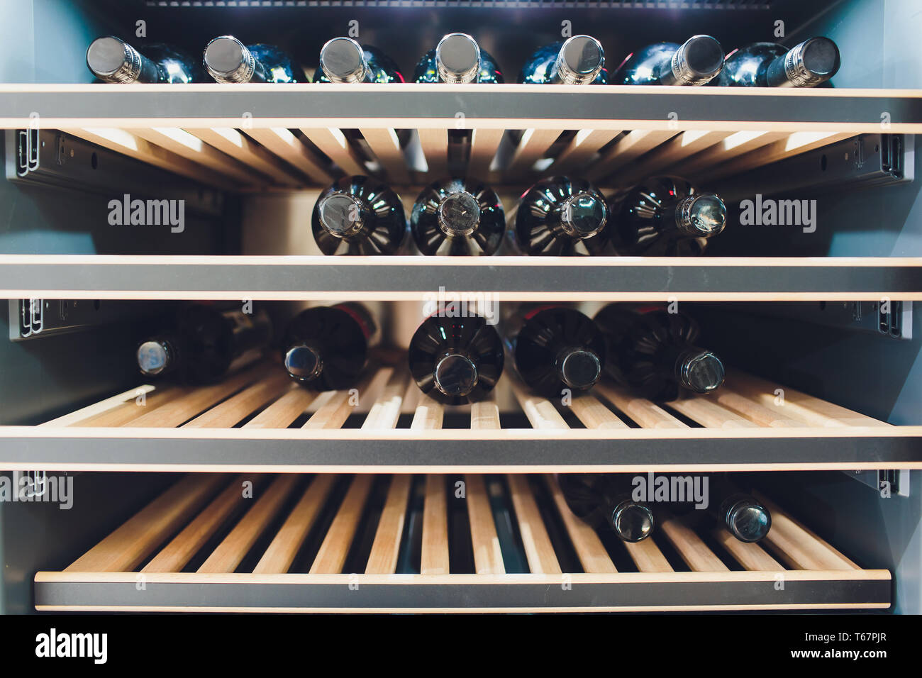 Storing bottles of wine in fridge. Alcoholic card in restaurant