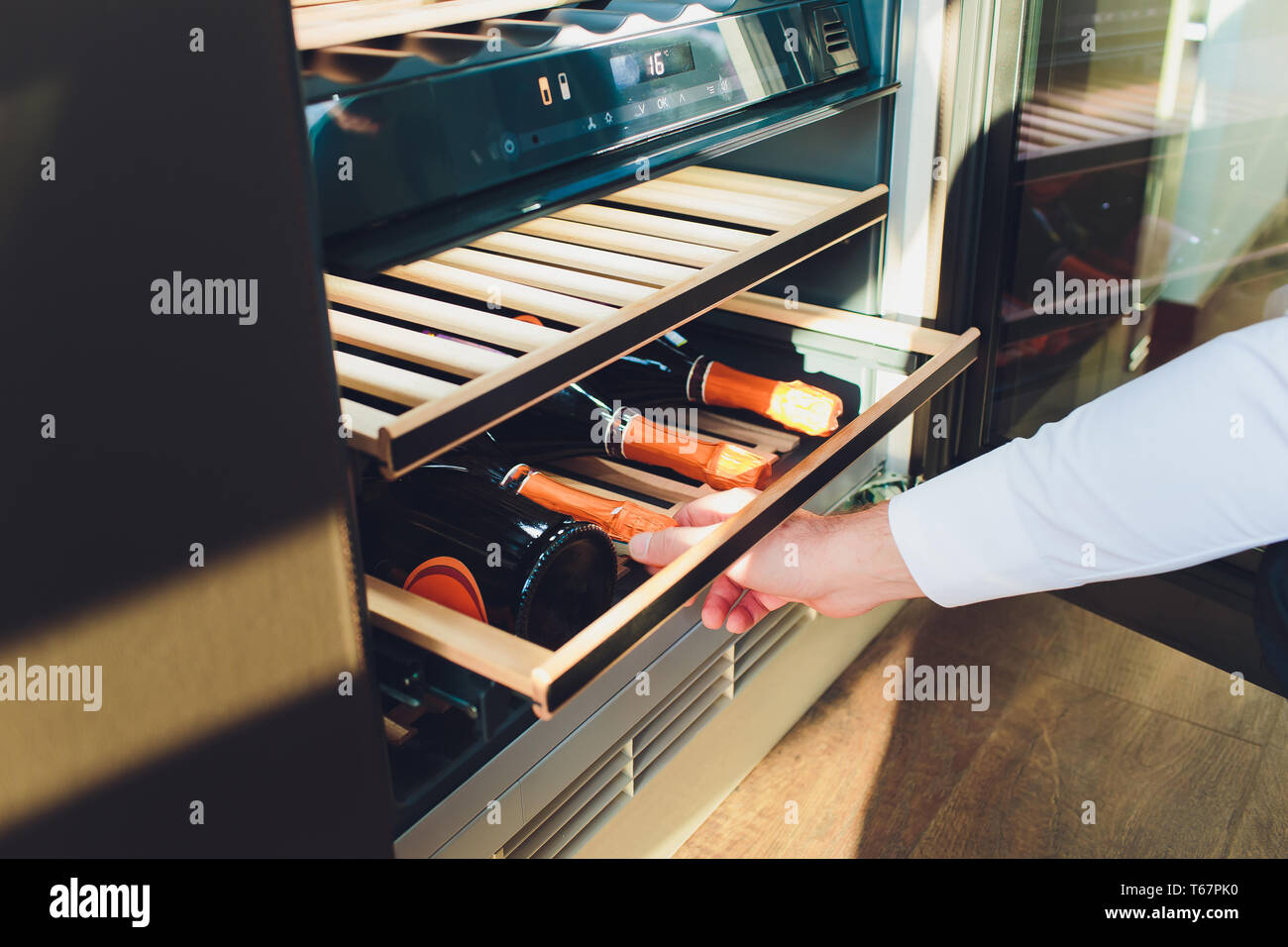 Storing bottles of wine in fridge. Alcoholic card in restaurant