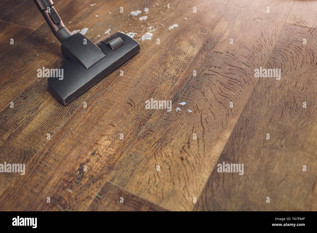 Dark Head Of A Modern Vacuum Cleaner Being Used While Vacuuming A