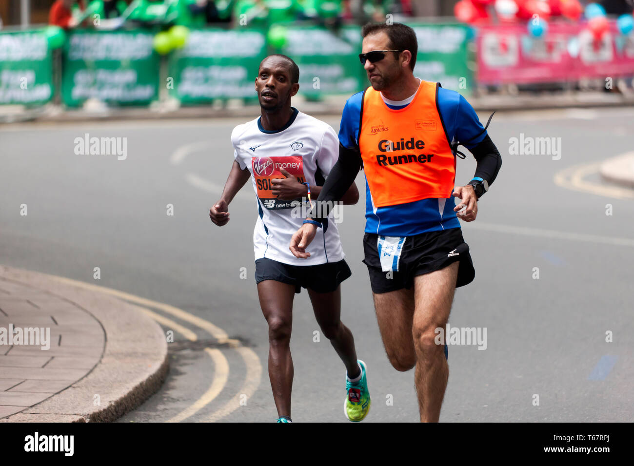Avi Adhanany Solomon with his guide runner,  competing for Israel,  in the World Para Athletic Championships, part of the 2019 London Marathon. He finished 16th, in the T11/12 category Stock Photo