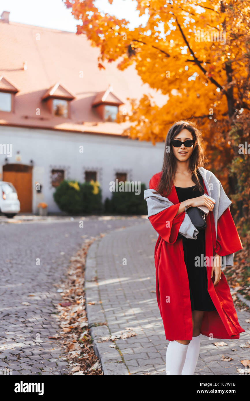 Fashion portrait of beautiful woman in autumn park Stock Photo - Alamy