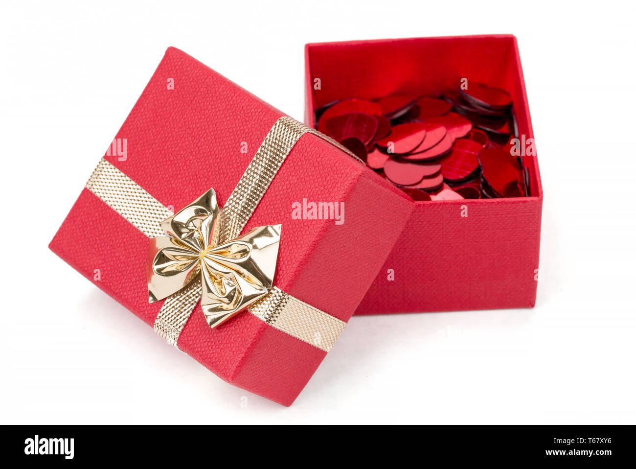 Red hearts confetti in box on white background Stock Photo Alamy