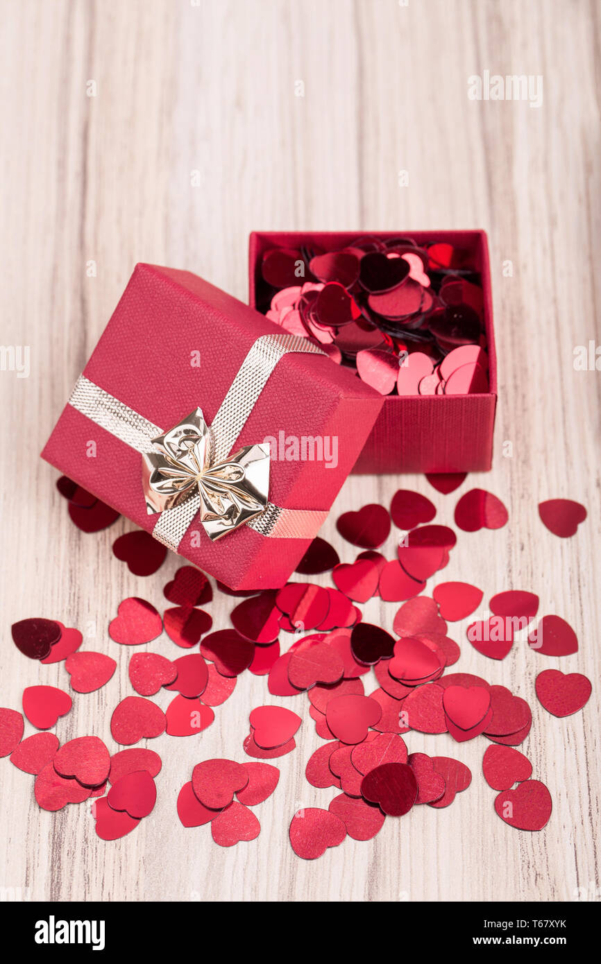 Red hearts confetti in box valentine love concept Stock Photo Alamy