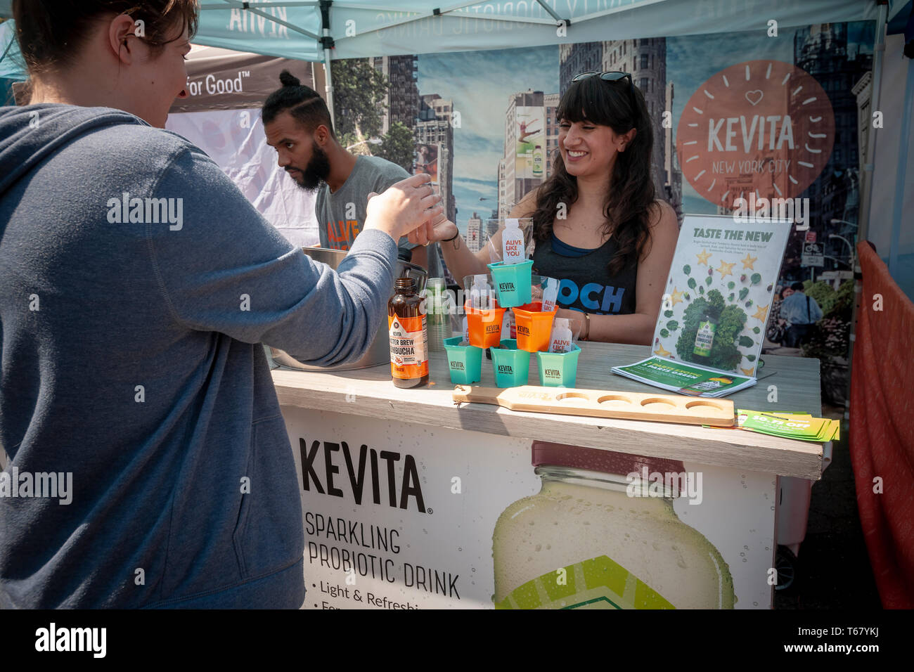 Workers distribute samples of PepsiCo owned Kevita brand Kombucha at the Earth Day Street Fair in Union Square Park in New York on Tuesday, April 23, 2019. The fair featured booths from various companies and organizations touting their environmental awareness. (Â© Richard B. Levine) Stock Photo