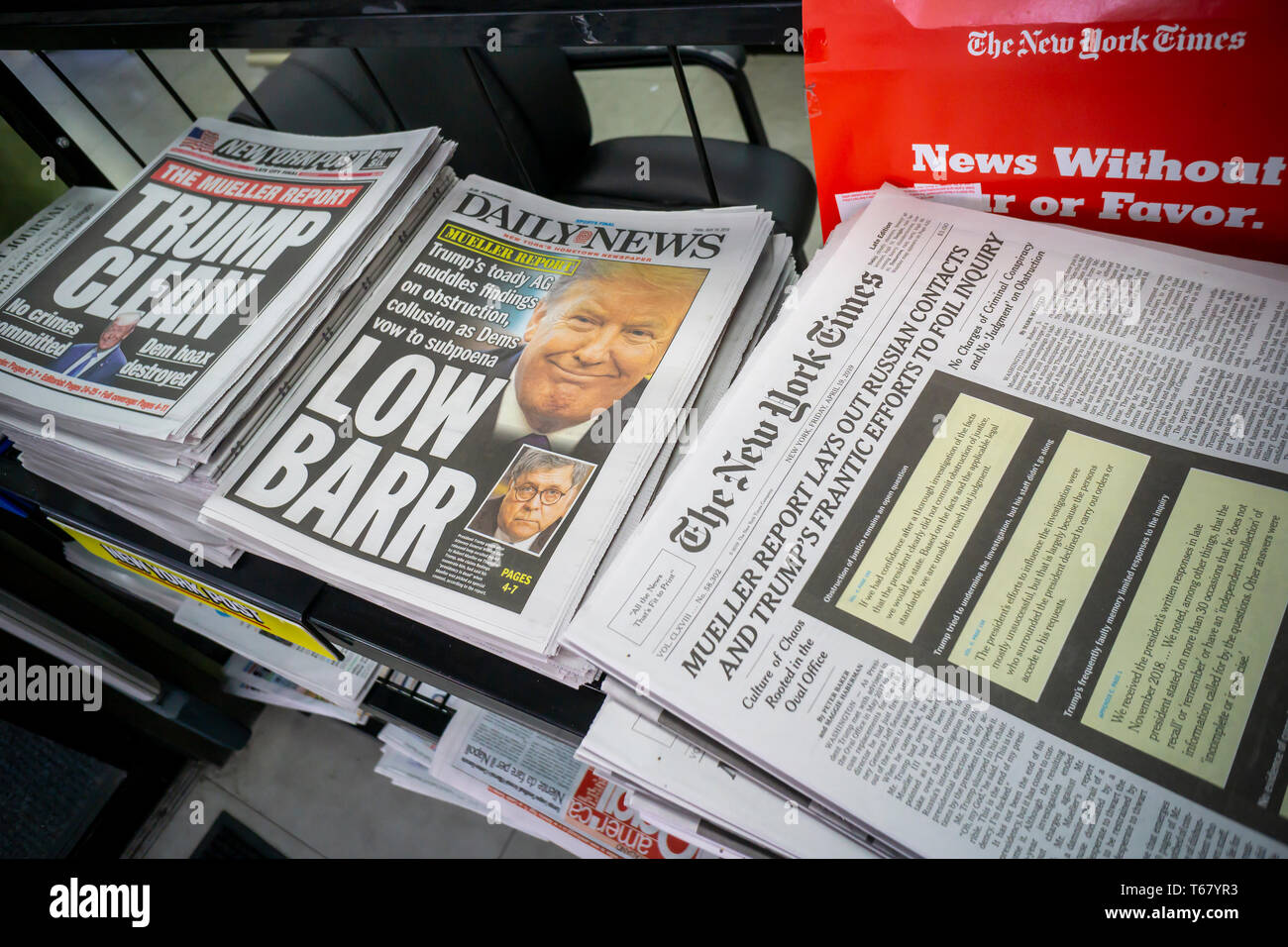 Headlines of the NY Daily News and the NY Post have divergent views on Friday, April 19, 2019 on the previous dayâ€™s release of the redacted report by special counsel Robert Mueller on Russian meddling in the presidential election and possible collusion by the Trump campaign and Attorney General William Barr's press conference of the report. (Â© Richard B. Levine) Stock Photo