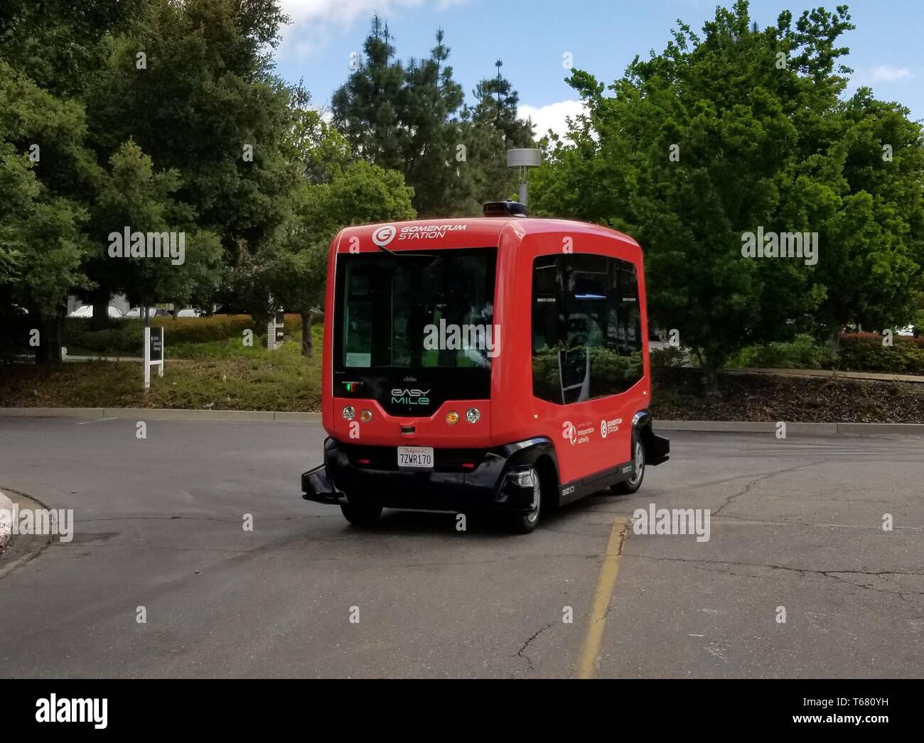 Driverless shuttle from self driving vehicle company Easy Mile driving through the Bishop Ranch office park in San Ramon, California, the first fully autonomous shuttle bus authorized to drive on public roads in the State of California, April 17, 2019. () Stock Photo