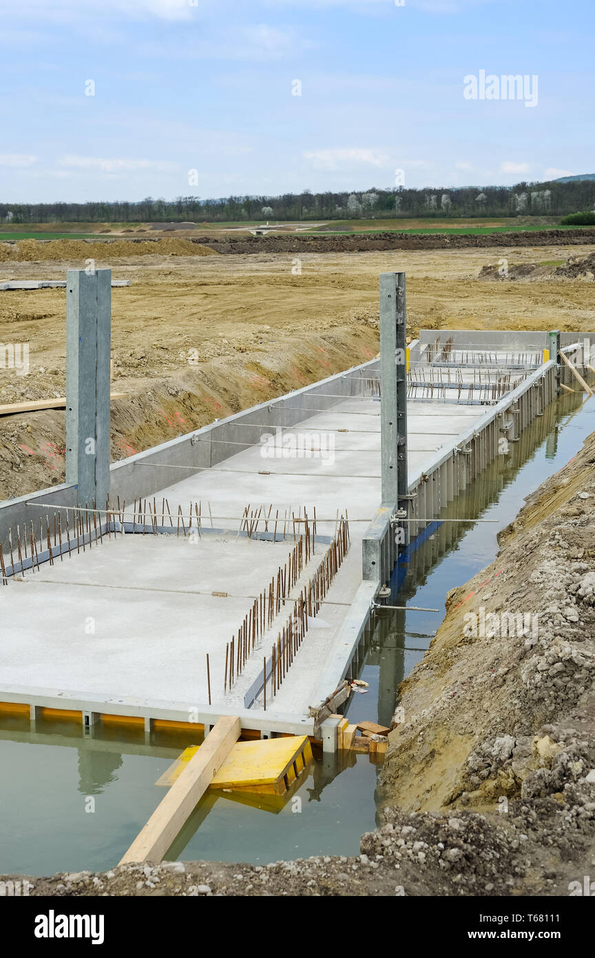 Construction with reinforced concrete in channel Stock Photo - Alamy