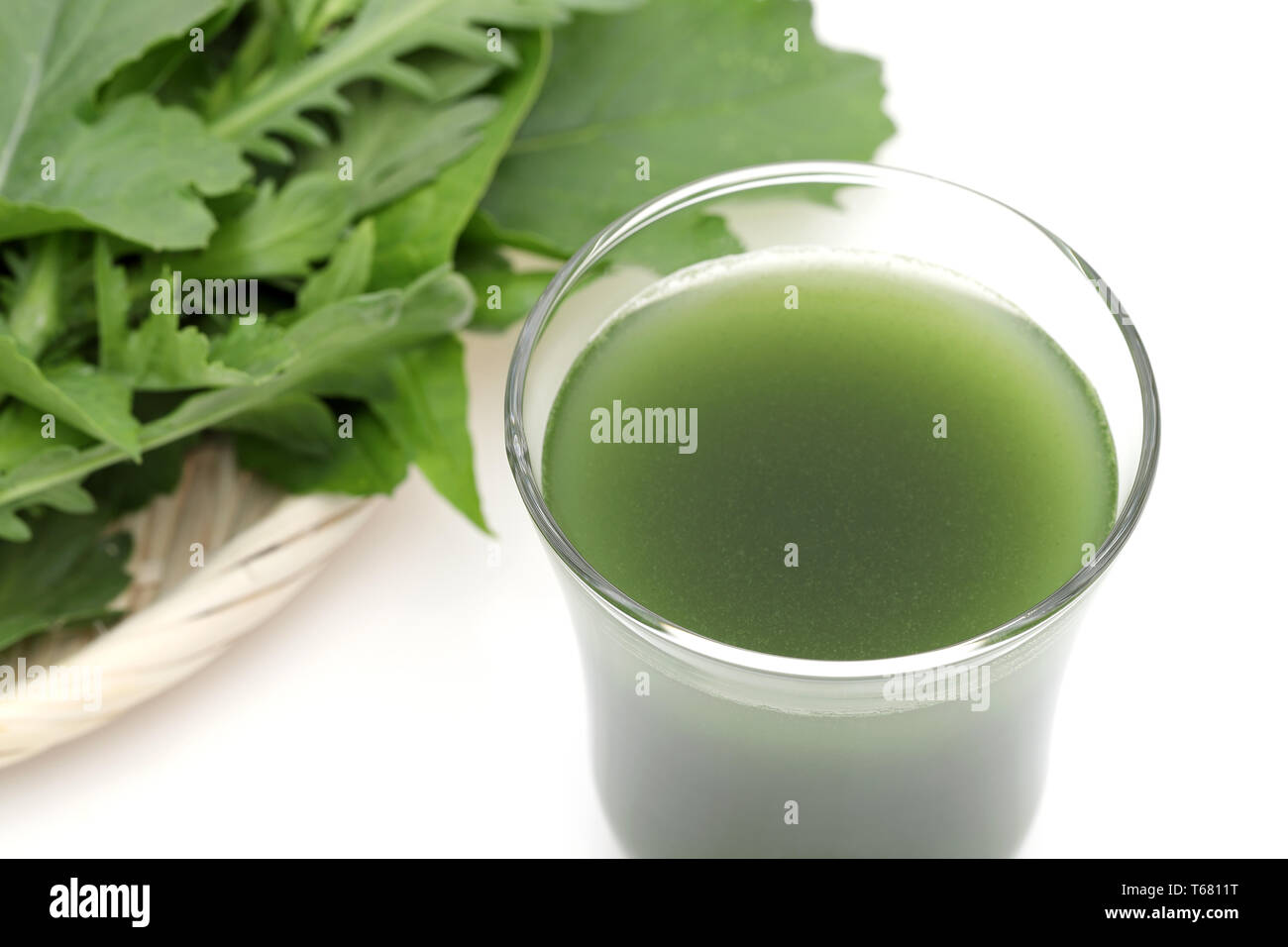Glass of green vegetable juice on white background, Vegetable juice