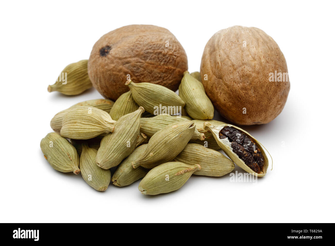 Nutmeg and cardamom pods isolated on white background Stock Photo Alamy