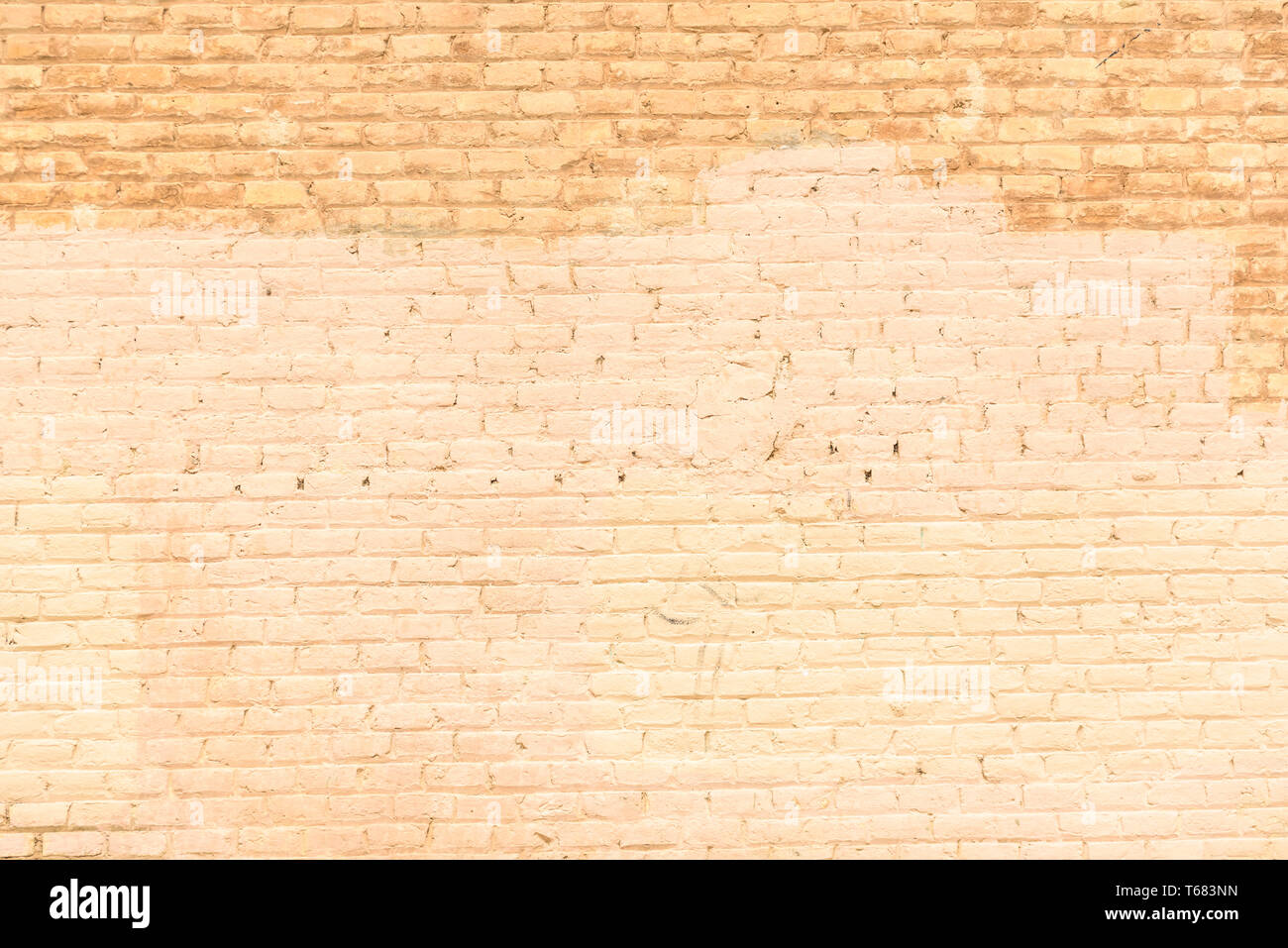 Texture of a brick wall painted in orange tones, ideal for background ...