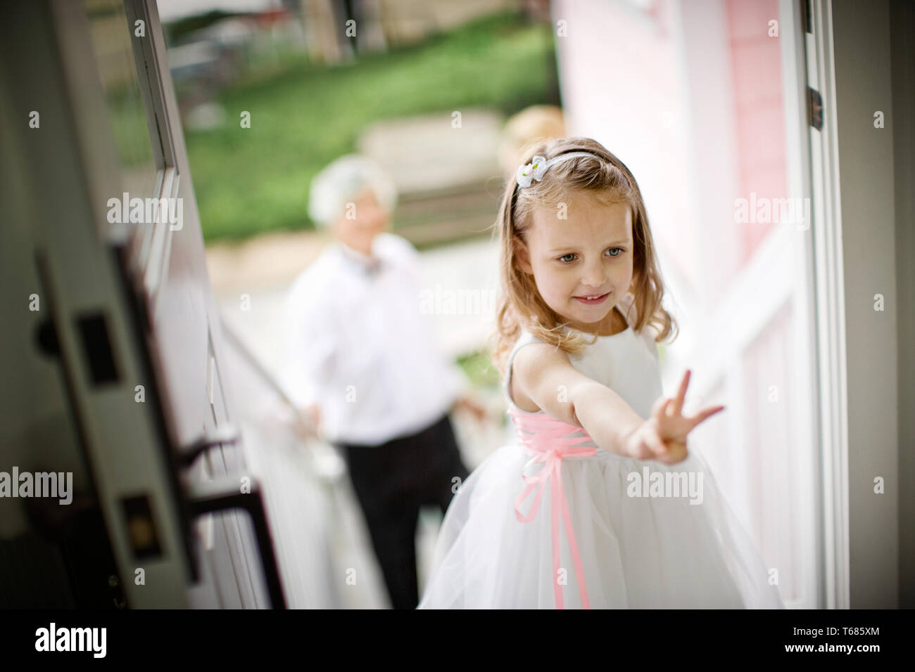 Young girl dressed as a flower girl. Stock Photo