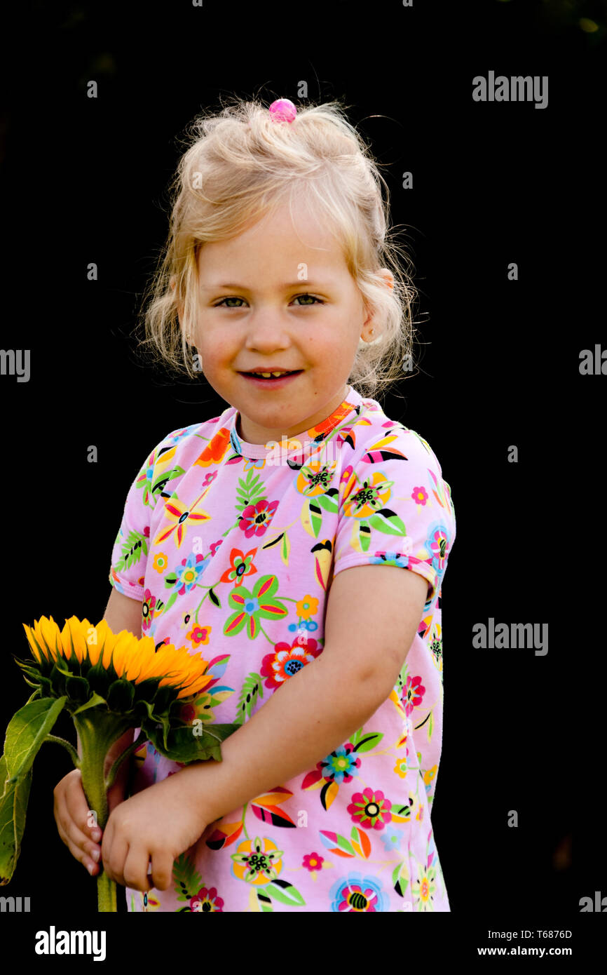 little girl with sunflower Stock Photo - Alamy