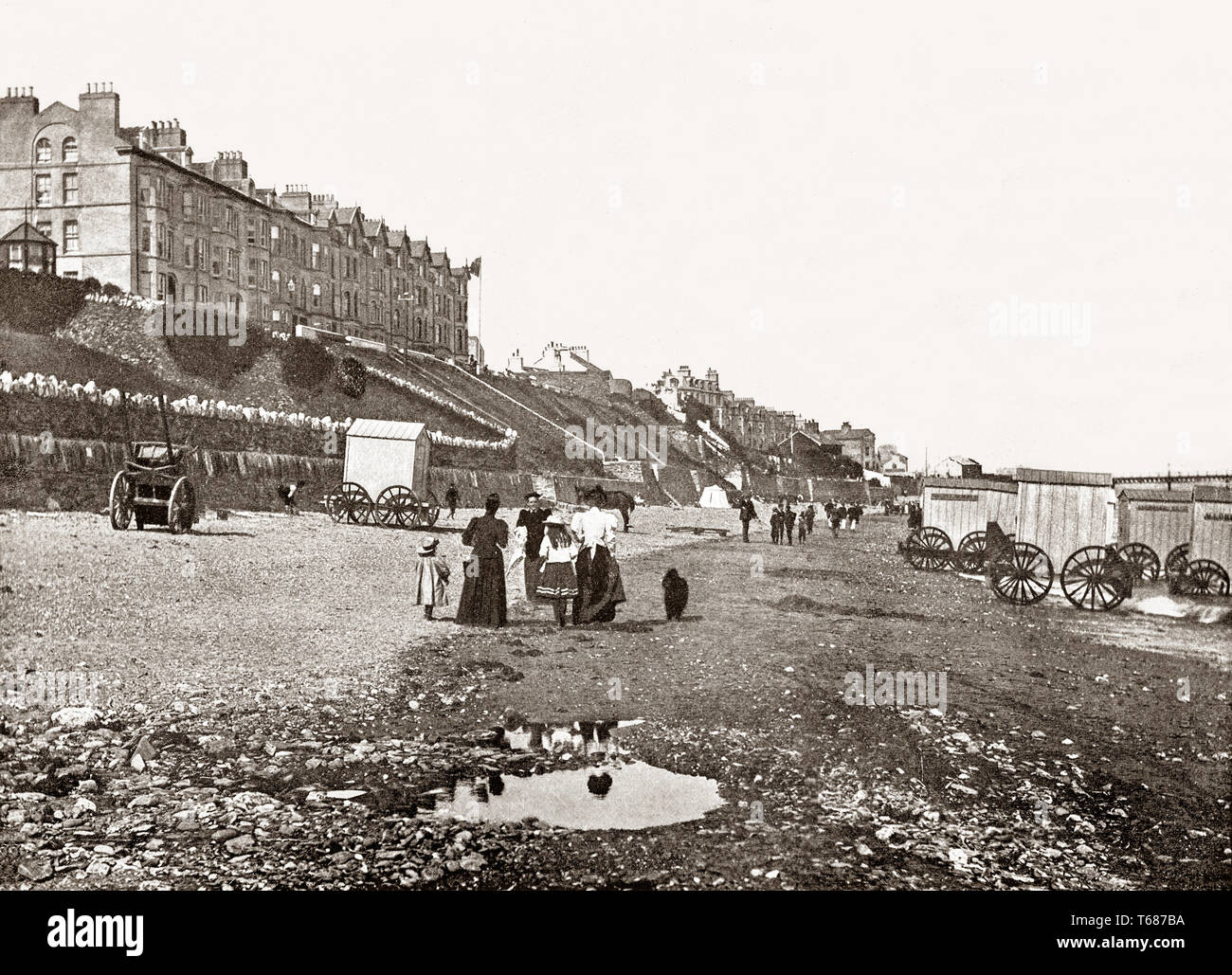 A 19th Century view of Victorian bathing machines on the beach at Ramsey, a coastal town in the north of the Isle of Man, a self-governing British Crown dependency in the Irish Sea between Great Britain and Ireland.  It is the second largest town on the island after Douglas. It's  also known as 'Royal Ramsey' due to royal visits by Queen Victoria and Prince Albert in 1847 and by King Edward VII and Queen Alexandra in 1902. Stock Photo