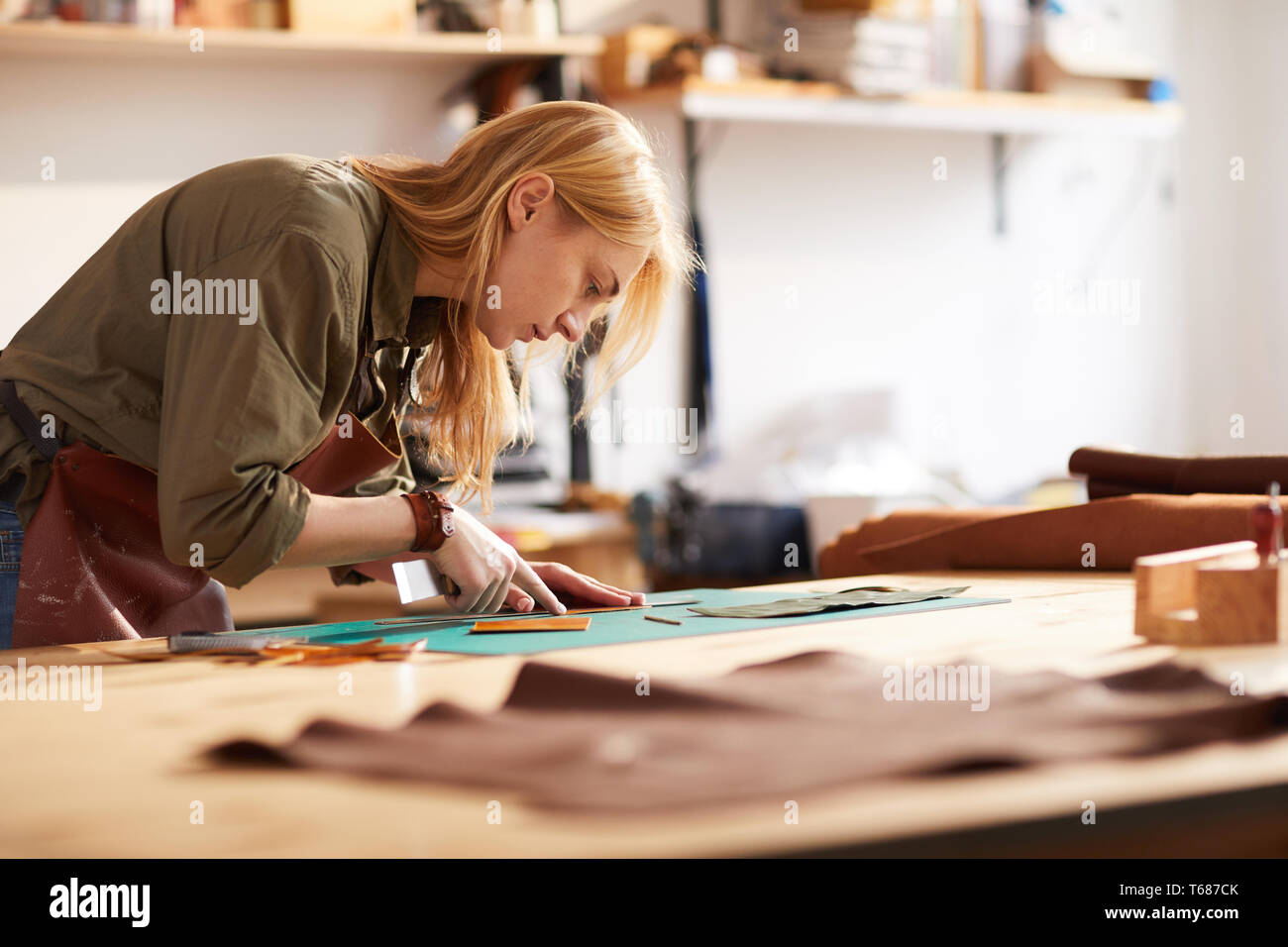 Female Tailor Working with Leather Stock Photo Alamy
